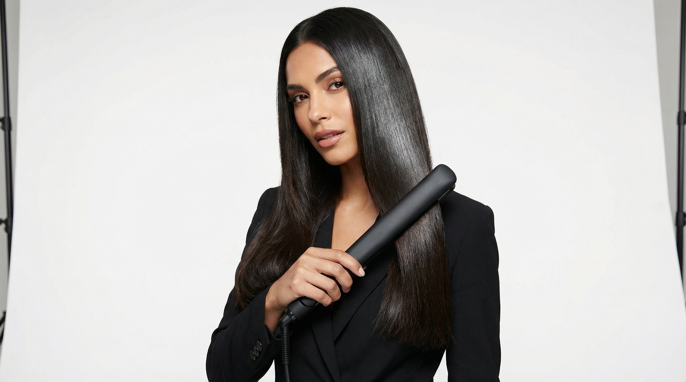 woman straightening thick hair without frizz styling tutorial